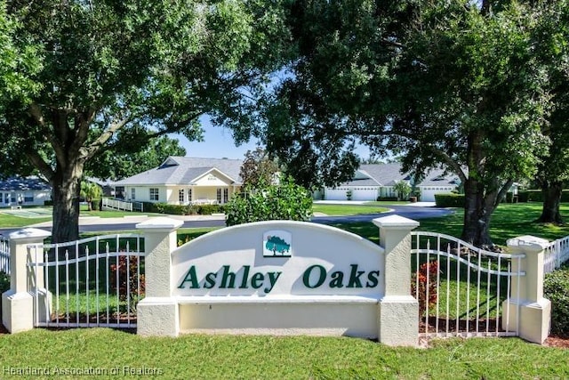 2033 Ashley Oaks Cir, Sebring, FL 33870 - community sign featuring a residential view and fence
