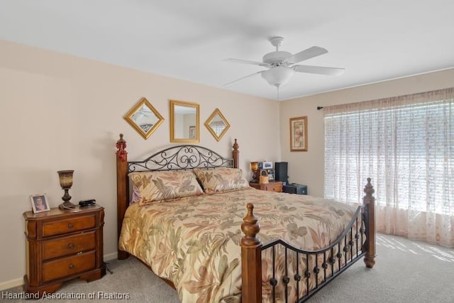 2033 Ashley Oaks Cir, Sebring, FL 33870 - bedroom featuring light carpet, baseboards, and a ceiling fan