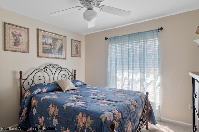 2033 Ashley Oaks Cir, Sebring, FL 33870 - carpeted bedroom with baseboards, multiple windows, and a ceiling fan