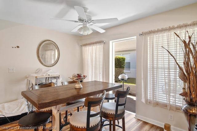 2033 Ashley Oaks Cir, Sebring, FL 33870 - dining area featuring ceiling fan, baseboards, and light wood finished floors