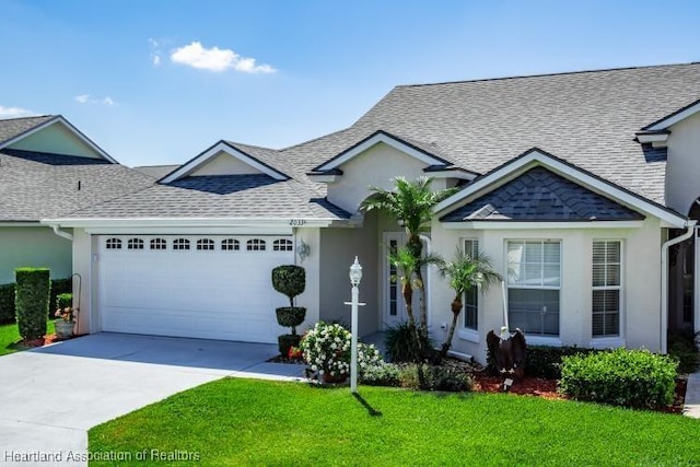 2033 Ashley Oaks Cir, Sebring, FL 33870 - view of front of property featuring an attached garage, stucco siding, and driveway
