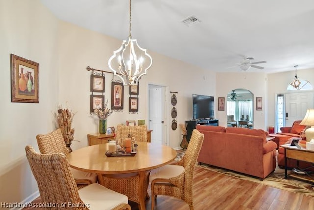 2033 Ashley Oaks Cir, Sebring, FL 33870 - dining space with light wood finished floors, visible vents, and ceiling fan with notable chandelier