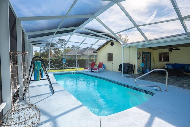 view of swimming pool featuring glass enclosure, a patio area, and area for grilling