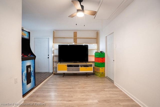 living room featuring light wood-type flooring and ceiling fan