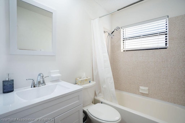 full bathroom featuring vanity, toilet, and shower / bathtub combination with curtain