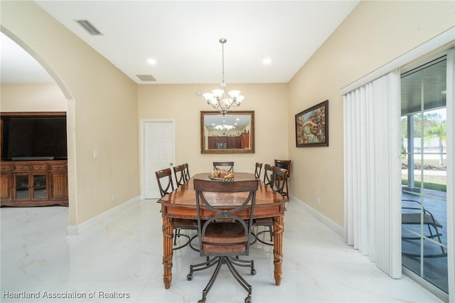 dining area with a notable chandelier