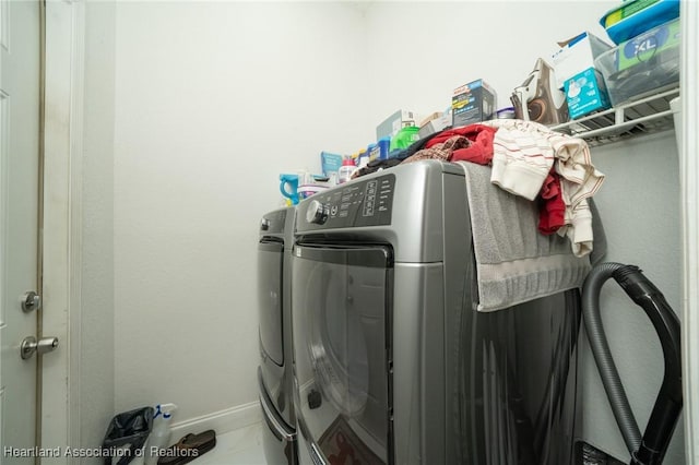 washroom featuring washing machine and dryer