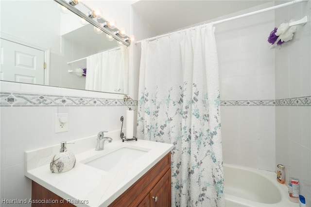 bathroom with vanity and shower / bath combination with curtain