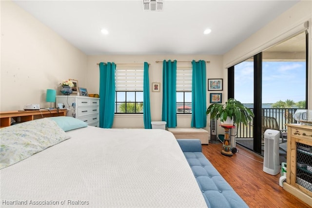 2351 Lakeview Dr Unit 219, Sebring, FL 33870 - bedroom with wood finished floors, access to exterior, and recessed lighting