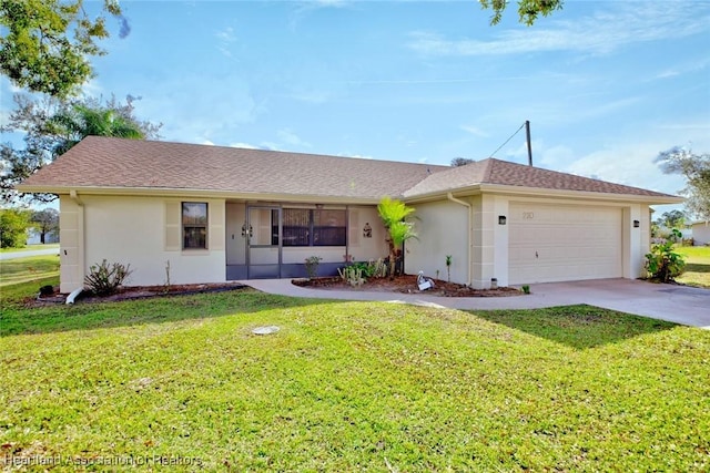 ranch-style house featuring a front lawn and a garage