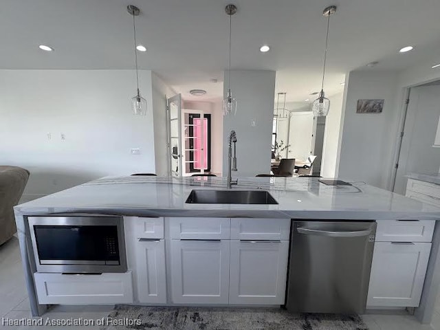 kitchen with white cabinetry, recessed lighting, appliances with stainless steel finishes, and a sink