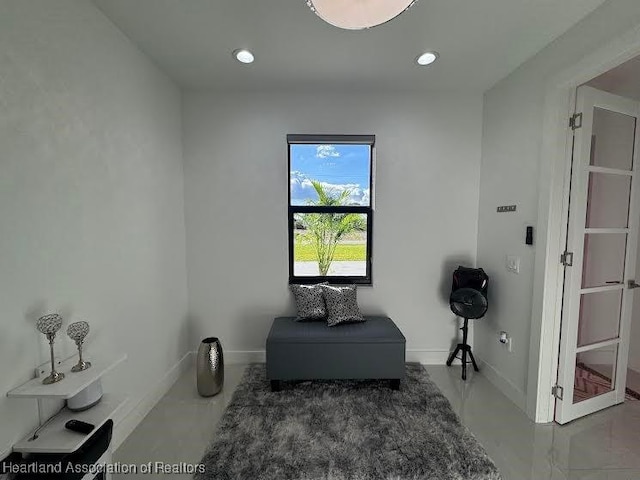 sitting room with recessed lighting and baseboards