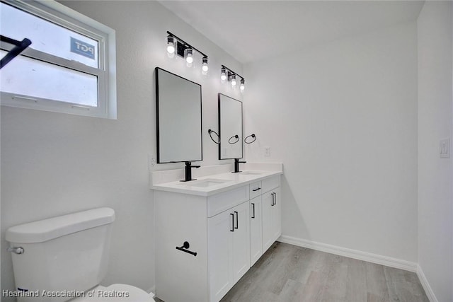 2731 W Albatross Rd, Avon Park, FL 33825 - bathroom featuring double vanity and wood finished floors
