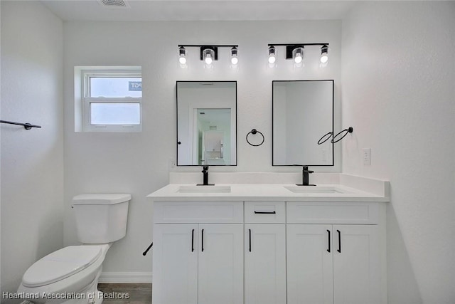 2731 W Albatross Rd, Avon Park, FL 33825 - bathroom with toilet and double vanity