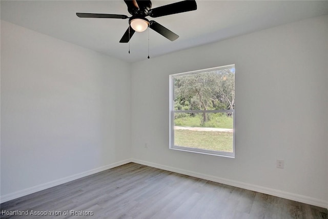 2731 W Albatross Rd, Avon Park, FL 33825 - empty room featuring wood finished floors and baseboards