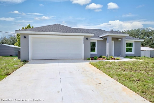 2731 W Albatross Rd, Avon Park, FL 33825 - view of front of property with stucco siding, concrete driveway, an attached garage, a front yard, and a shingled roof