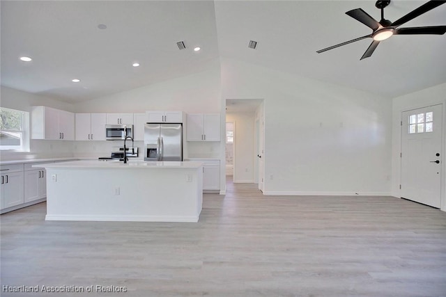 2731 W Albatross Rd, Avon Park, FL 33825 - kitchen featuring stainless steel appliances, light countertops, white cabinetry, light wood-type flooring, and a ceiling fan