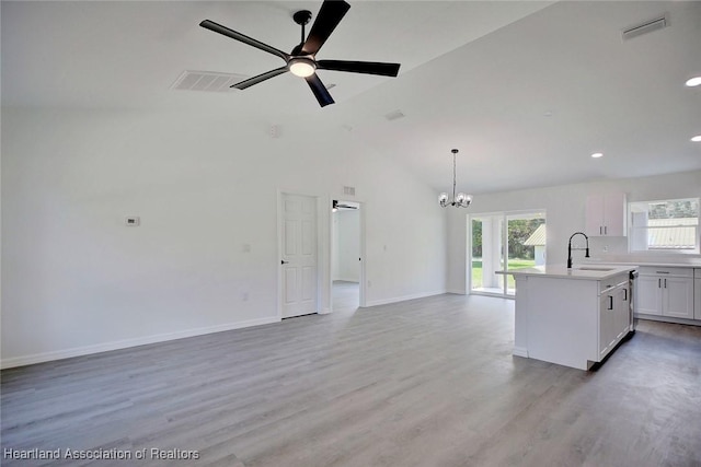 2731 W Albatross Rd, Avon Park, FL 33825 - kitchen with healthy amount of natural light, open floor plan, a ceiling fan, a chandelier, and lofted ceiling