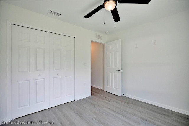 2731 W Albatross Rd, Avon Park, FL 33825 - unfurnished bedroom with wood finished floors, a closet, and ceiling fan