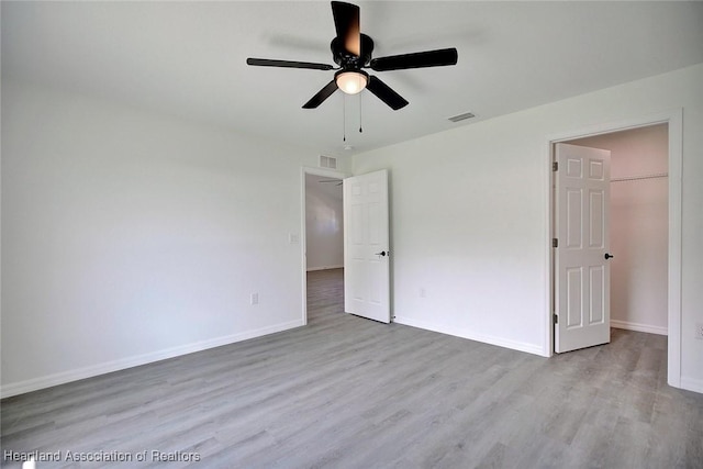 2731 W Albatross Rd, Avon Park, FL 33825 - unfurnished bedroom featuring wood finished floors and a ceiling fan