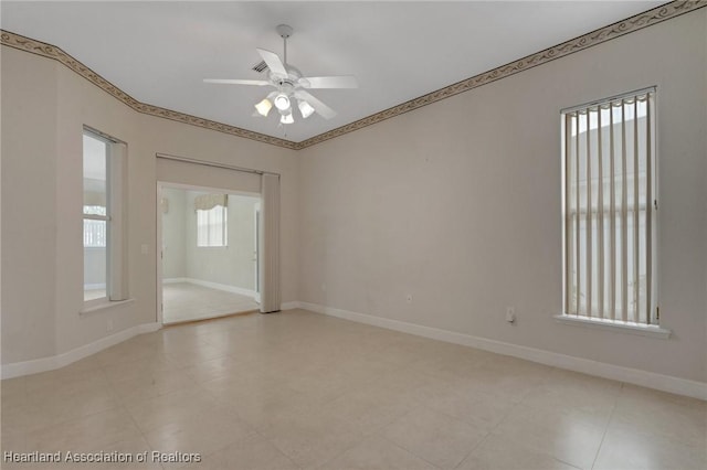 302 Ruby Ln, Winter Haven, FL 33884 - spare room with a ceiling fan and baseboards