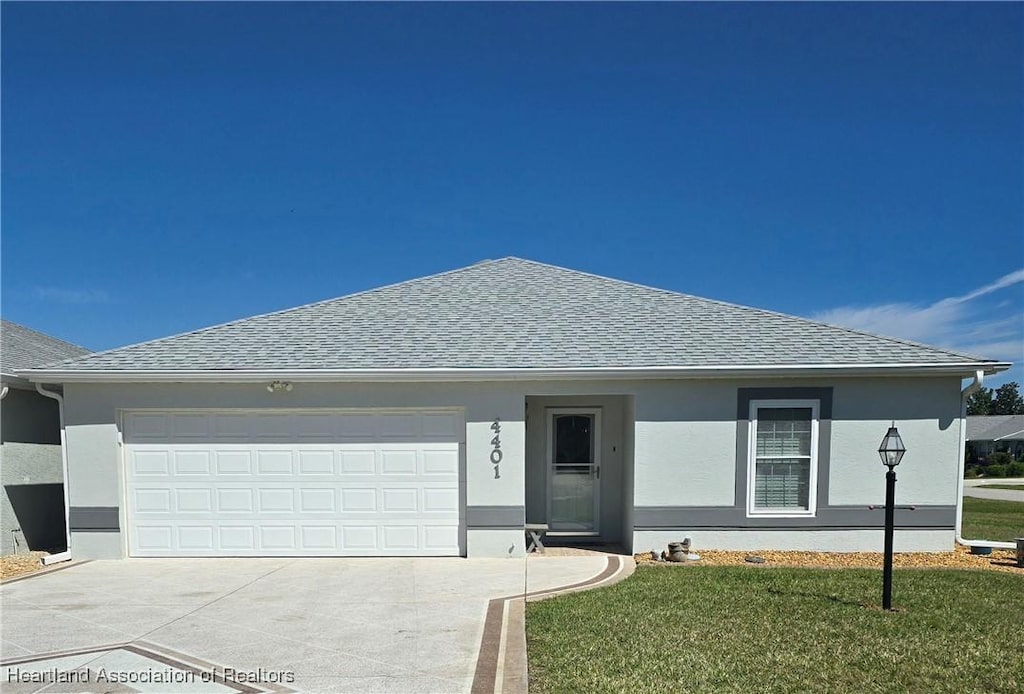 single story home featuring a shingled roof, concrete driveway, a garage, and stucco siding