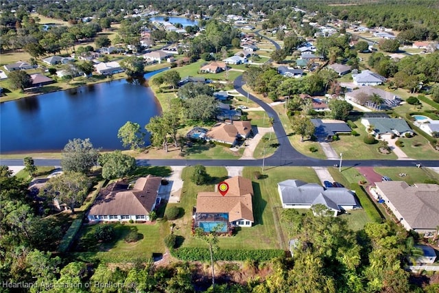 bird's eye view featuring a residential view and a water view