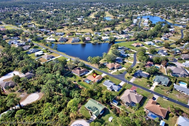 aerial view featuring a water view and a residential view