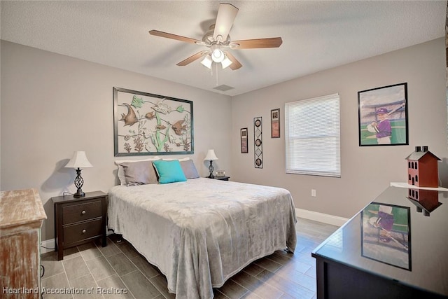 bedroom featuring a textured ceiling and ceiling fan