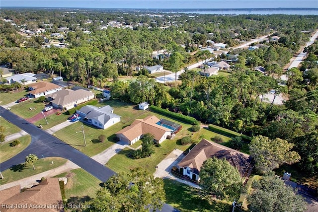 aerial view with a forest view and a residential view