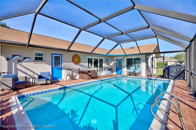 pool featuring a lanai, an outdoor hangout area, and a patio