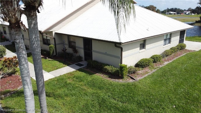 view of home's exterior featuring a yard