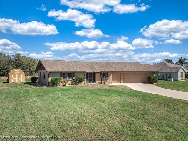 ranch-style home featuring a garage, a shed, a front lawn, and stucco siding