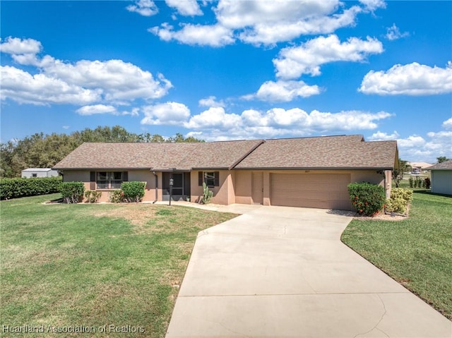 ranch-style home featuring a garage, driveway, a front yard, and stucco siding