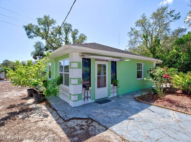 224 Montego Dr, Sebring, FL 33870 - exterior space with stucco siding