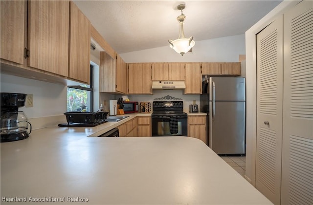 kitchen with light countertops, freestanding refrigerator, lofted ceiling, under cabinet range hood, and black range with electric cooktop
