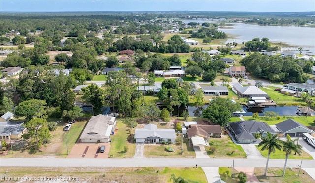 drone / aerial view featuring a water view and a residential view