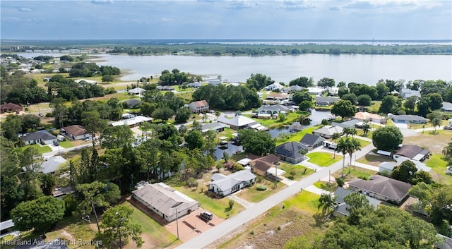 birds eye view of property featuring a water view and a residential view