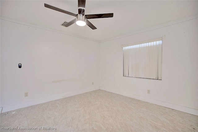 spare room with ceiling fan and crown molding