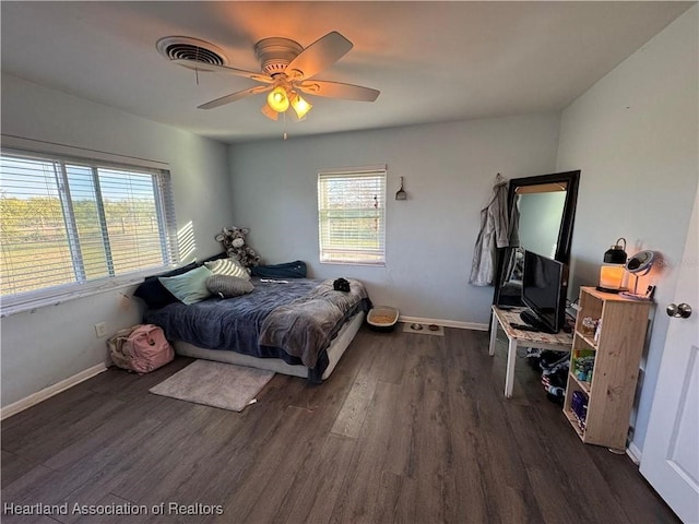 bedroom featuring dark hardwood / wood-style floors and ceiling fan