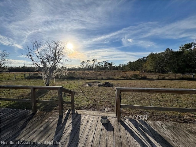 wooden terrace featuring a rural view