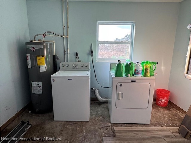 laundry area featuring water heater and washing machine and clothes dryer