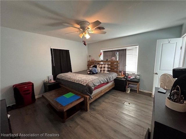 bedroom with ceiling fan and wood-type flooring