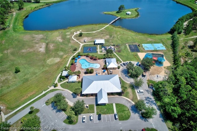 birds eye view of property with a water view