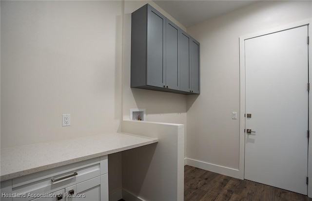 laundry room featuring cabinets, hookup for a washing machine, and dark wood-type flooring