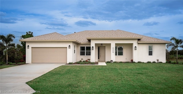 view of front of house featuring a garage and a front yard