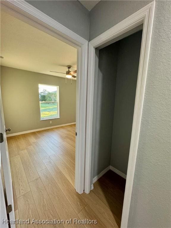 hallway with light wood-type flooring