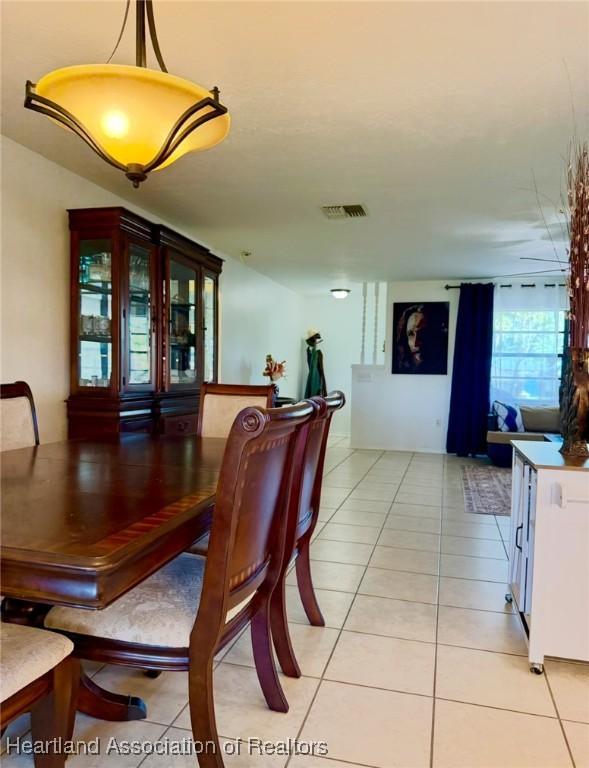 315 Sirena Dr, Lake Placid, FL 33852 - dining room featuring visible vents and light tile patterned flooring