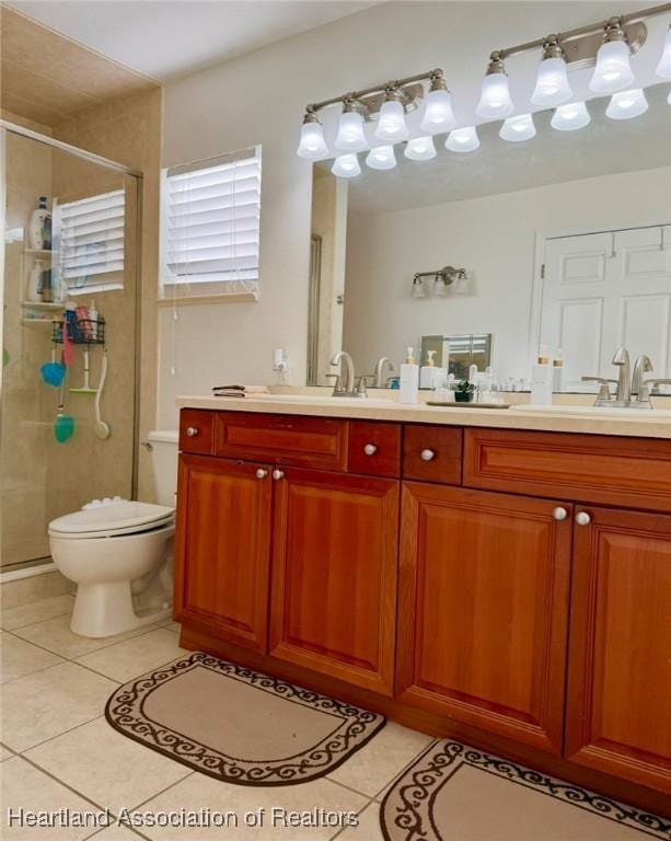 315 Sirena Dr, Lake Placid, FL 33852 - full bath with tile patterned floors, toilet, a stall shower, a sink, and double vanity