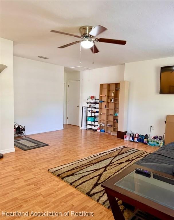 315 Sirena Dr, Lake Placid, FL 33852 - living area featuring wood finished floors, attic access, a ceiling fan, and visible vents